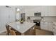 Bright kitchen showcasing white cabinets, stainless steel appliances, and a large island with seating at 7297 E Black Rock Rd, Scottsdale, AZ 85255