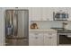 Modern kitchen with stainless steel appliances, white cabinets, and quartz countertops at 7297 E Black Rock Rd, Scottsdale, AZ 85255