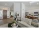 Bright open-concept living room with modern decor flowing into kitchen and entryway for seamless entertaining at 7297 E Black Rock Rd, Scottsdale, AZ 85255