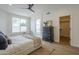 Bright bedroom showcases a ceiling fan, a decorative rug, with an ensuite bathroom at 7297 E Black Rock Rd, Scottsdale, AZ 85255