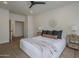 Cozy bedroom interior with a ceiling fan, neutral decor, and tile floors at 7297 E Black Rock Rd, Scottsdale, AZ 85255