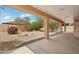Relaxing back patio overlooking the desert landscaping and mature trees at 7546 W Mary Jane Ln, Peoria, AZ 85382