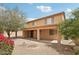 Expansive backyard featuring covered patio, low-maintenance desert landscaping, and colorful bougainvillea at 7546 W Mary Jane Ln, Peoria, AZ 85382