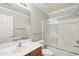 Neutral bathroom with a shower-tub combo and a vanity with a wooden base at 7546 W Mary Jane Ln, Peoria, AZ 85382