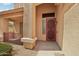 Covered front entryway with a security door and desert landscaping at 7546 W Mary Jane Ln, Peoria, AZ 85382