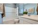 Bright bathroom featuring a shower-tub combo, neutral walls, vanity with a modern faucet, and a window providing natural light at 8149 E Petunia Ave # 1007, Mesa, AZ 85212