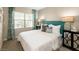 Comfortable bedroom with a plush bed, side tables, and neutral decor at 8149 E Petunia Ave # 1007, Mesa, AZ 85212