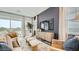 Comfortable living room with a wall-mounted television and stylish furnishings at 8149 E Petunia Ave # 1007, Mesa, AZ 85212