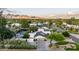 Aerial view of a desert home featuring a pool, tennis court, and mountain views at 8230 E Wood Dr, Scottsdale, AZ 85260