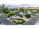 Aerial view of a home with desert landscaping, large driveway, and mountain views at 8230 E Wood Dr, Scottsdale, AZ 85260