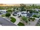 Aerial view of a modern home showcasing the circular driveway and desert landscaping at 8230 E Wood Dr, Scottsdale, AZ 85260