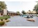 Inviting backyard pool with stone patio, lounge chairs, and a covered dining area for ultimate relaxation and gatherings at 8230 E Wood Dr, Scottsdale, AZ 85260