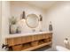 Bathroom with modern sink, wooden storage elements, and unique vanity lighting at 8230 E Wood Dr, Scottsdale, AZ 85260