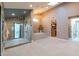 Modern bathroom features a glass shower, soaking tub, and elegant lighting at 8230 E Wood Dr, Scottsdale, AZ 85260