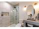 Modern bathroom with glass-enclosed shower, sleek fixtures, and stylish decorative elements at 8230 E Wood Dr, Scottsdale, AZ 85260