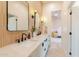 Bright bathroom with double sink vanity, modern fixtures, and hardwood accents at 8230 E Wood Dr, Scottsdale, AZ 85260
