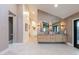 Contemporary bathroom featuring double vanities, modern lighting, and access to a glass shower at 8230 E Wood Dr, Scottsdale, AZ 85260