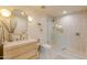 Modern bathroom with a walk-in shower, stylish vanity, and updated fixtures at 8230 E Wood Dr, Scottsdale, AZ 85260