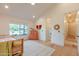 Bright bedroom with a view features hardwood floors and vaulted ceilings, creating a cozy atmosphere at 8230 E Wood Dr, Scottsdale, AZ 85260