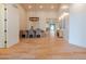 Open-concept dining room featuring light wood floors, modern decor, and ample natural light at 8230 E Wood Dr, Scottsdale, AZ 85260