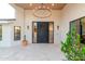 Inviting front entrance featuring a statement chandelier and modern design elements at 8230 E Wood Dr, Scottsdale, AZ 85260