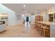 Open kitchen with a large island and stylish wooden barstools at 8230 E Wood Dr, Scottsdale, AZ 85260
