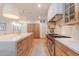 Modern kitchen featuring a large island with white countertops and state-of-the-art stainless steel appliances at 8230 E Wood Dr, Scottsdale, AZ 85260