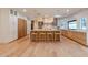 Gourmet kitchen with large island, custom cabinetry, and modern pendant lighting at 8230 E Wood Dr, Scottsdale, AZ 85260