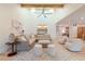 Open-concept living room with high ceilings, comfortable seating area, bar, and lots of natural light at 8230 E Wood Dr, Scottsdale, AZ 85260