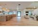 Open living space with bar seating, cozy living area, and modern lighting fixtures at 8230 E Wood Dr, Scottsdale, AZ 85260