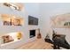 Well-appointed office space featuring built-in shelving, desk, and stylish decor at 8230 E Wood Dr, Scottsdale, AZ 85260