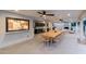 Outdoor kitchen and dining area with built-in appliances and a spacious table for entertaining at 8230 E Wood Dr, Scottsdale, AZ 85260