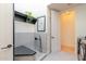 This indoor pet washing station offers a convenient space with tile and shelving for pet care at 8230 E Wood Dr, Scottsdale, AZ 85260