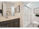 Modern bathroom featuring a glass-enclosed shower, sleek vanity, and elegant decor at 8251 E Petunia Ave, Mesa, AZ 85212