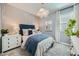 Stylishly designed bedroom with a plush bed, designer wall art, and ample natural light at 8251 E Petunia Ave, Mesa, AZ 85212