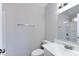 Bathroom featuring a bright vanity with a mirror and modern fixtures, toilet, and tiled shower at 863 Leisure World --, Mesa, AZ 85206