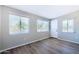 Clean bedroom with laminate flooring, fresh paint, and multiple large windows for natural light at 863 Leisure World --, Mesa, AZ 85206