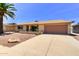 Single Gathering home showing the front yard, driveway, garage, and some stonework at 863 Leisure World --, Mesa, AZ 85206