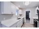 Clean, renovated kitchen featuring stainless steel appliances, bright white cabinets and quartz countertops at 863 Leisure World --, Mesa, AZ 85206
