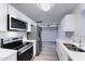 Renovated kitchen featuring stainless steel appliances, bright white cabinets and quartz countertops at 863 Leisure World --, Mesa, AZ 85206