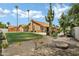Inviting backyard with a well-maintained lawn and desert landscaping at 8913 S Forest Ave, Tempe, AZ 85284