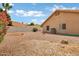 Backyard features privacy fence and desert landscaping with decorative rock creates low maintenance living at 8913 S Forest Ave, Tempe, AZ 85284