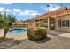 Backyard featuring a pool, covered patio, desert landscaping, and privacy fence at 8913 S Forest Ave, Tempe, AZ 85284