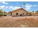 This home's backyard features mature landscaping and decorative rock for low-maintenance desert living at 8913 S Forest Ave, Tempe, AZ 85284