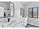 Modern bathroom featuring double sinks, white cabinets, and sleek black fixtures at 8913 S Forest Ave, Tempe, AZ 85284