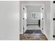View of a bedroom with wood floors and a window with white shutters seen from the doorway at 8913 S Forest Ave, Tempe, AZ 85284