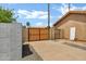Gated driveway with a privacy fence and well-manicured yard at 8913 S Forest Ave, Tempe, AZ 85284