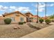 Charming single-story home featuring a neutral color palette, tile roof, and rock landscaping at 8913 S Forest Ave, Tempe, AZ 85284