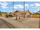 Charming single-story home featuring a neutral color palette, tile roof, and manicured landscaping at 8913 S Forest Ave, Tempe, AZ 85284