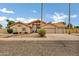 Charming single-story home featuring a neutral color palette, tile roof, manicured landscaping, and a spacious two-car garage at 8913 S Forest Ave, Tempe, AZ 85284